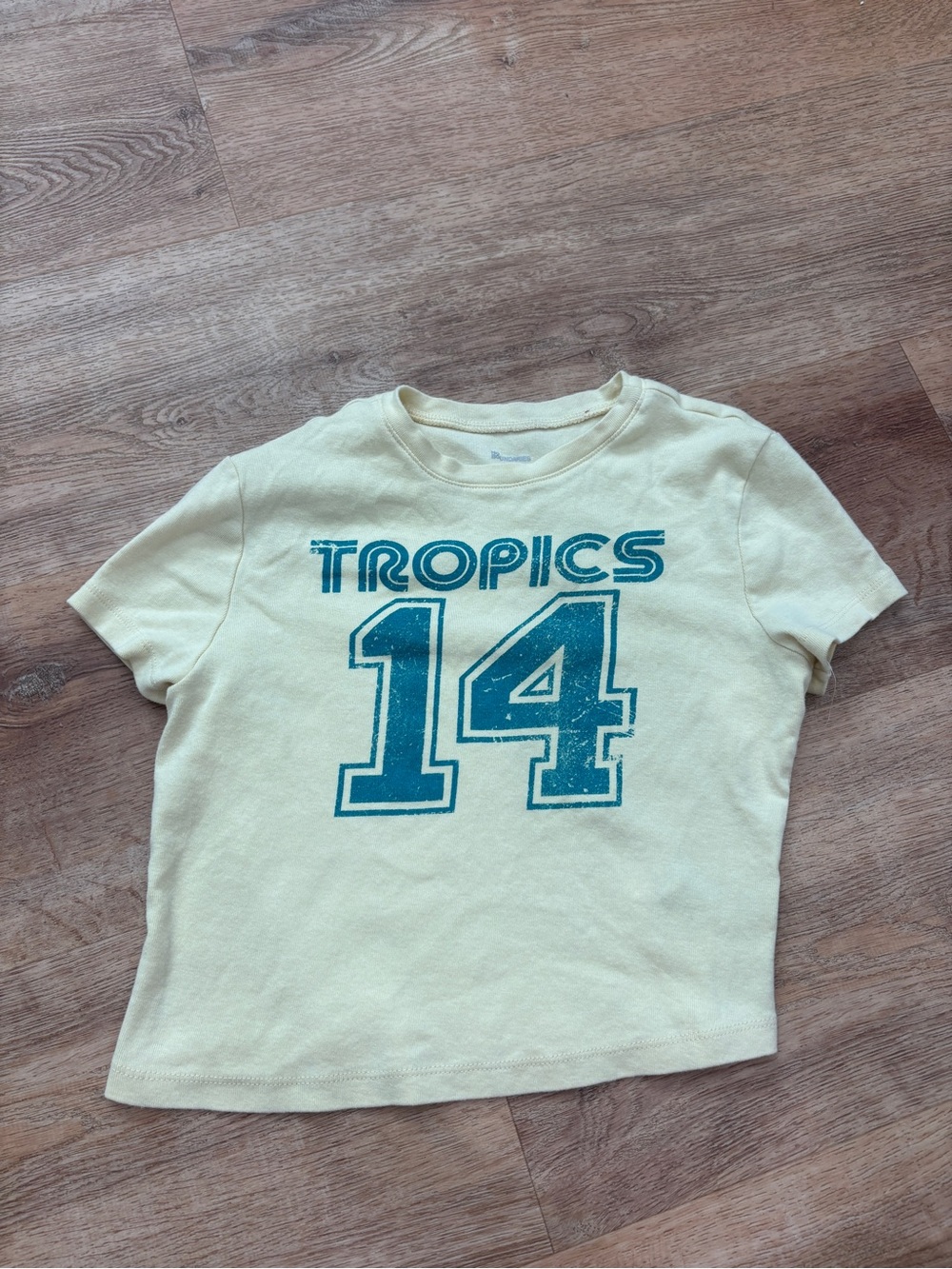 No Boundaries Cream Crop Tee with Blue 'Tropics 14' Graphic